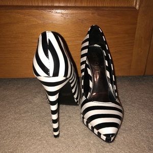 Elegant black and white high heel shoes